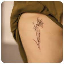 Symbol Of Rebirth New Beginnings Eternal Life I Would Get Several Together As A Tattoo Because It Symbolizes Jo Daffodil Tattoo Tattoos Small Flower Tattoos