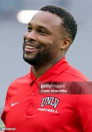 Defensive back Johnathan Baldwin of the UNLV Rebels is tackled by... News  Photo
