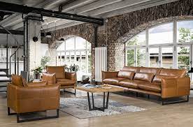 This sofa strikes a streamlined silhouette with a pair of back cushions, track arms, and round tapered legs in the finish. Design Sofa Kos In Luxuriosem Cognac Leder Mit Stahlbeinen Einzigartiges Robustes Sofa