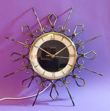 Add elegance and flare with a gold brushed metal frame clock to your dining room or foyer. Hilbink Mid Century Retro Metal Sunray Clock Electric Catawiki