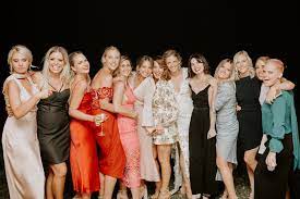Add a pop of color with the blue handbag. Wedding Tips Decode The Dress Code Tweed Coast Weddings