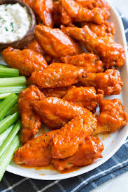 Seasoned and baked chicken wings (that are very tasty on their own) get a flaming hot bath in an extra spicy homemade buffalo wing sauce. Buffalo Wings Crispy Baked Chicken Wings Are Coated In An Addictive Fiery Hot Buffalo Wing Sauce And S In 2021 Buffalo Wings Baked Buffalo Wings Chicken Wing Sauces