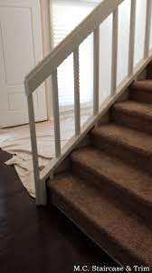 Staircase Remodel From M C Staircase Trim Removal Of Carpet Wooden Railing And Wooden Balusters Installation O Staircase Remodel Iron Balusters Staircase