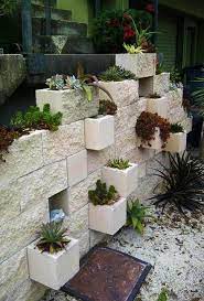 Whether used for an outdoor garden wall or as an interior basement wall, paint provides one answer for dressing up the boring gray blocks. 25 Concrete Block Ideas To Try And Enjoy Cheap Diy Outdoor Home Decorating Cinder Block Garden Backyard Landscaping Cinder Block Garden Wall