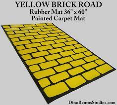 Without warning, they left behind everything: Yellow Brick Road Rubber Mat 36 X 60 Straight Dino Rentos Studios Inc
