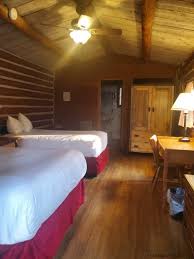 Colter bay tent cabins with two log walls, two canvas walls and a canvas roof that extends out over about half of the concrete patio. Colter Bay Cabins Grand Teton National Park Park Ranger John