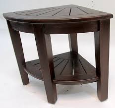 The most common corner shower stool material is wood. Teak Shower Stool