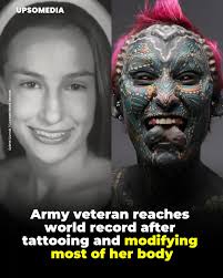 Esperance Lumineska Fuerzina, a 37-year-old army veteran from Connecticut,  has secured two Guinness World Records by covering 99.98% of her body with  tattoos and achieving the highest number of documented body modifications.