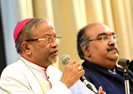 Archbishop Peter Machado addresses the media