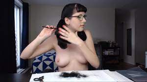 Nerdy dark-haired cuts her hair while nude and displays her bra-stuffers  and slit to the camera - uiPorn.com
