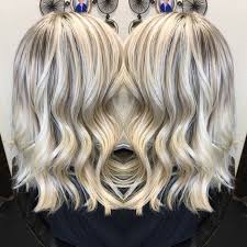 A feathered long blonde hairstyle is another example of a good hair color for women over 50. Icy White Hair Platinum Highlight And Lowlight Olaplex Long Layers Lob Long Hair Highlights Icy Blonde Hair Super Hair