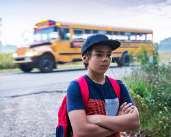 Image of reluctant student going to school