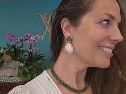 A neckpiece using Magenta Agate Cabochons and Pearls in 3 sizes...when I  wear it it fits perfectly around my neck...