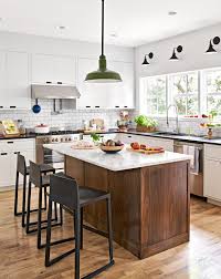 Dark wood cabinets are a timeless option to own in every type of kitchen, either modern or with a classic design. 22 Contrasting Kitchen Island Ideas For A Stand Out Space Better Homes Gardens