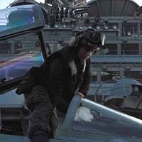 Sgt. Kyle Selman, bottom, and Cpl. Benjamin Cervantes rivet brackets into  the engine space of an F/A-18C Hornet.