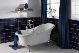 Whether it's a fine striped wallpaper or cerulean tiles, a refurbished vanity or ship's cabin accouterments, the blue bathroom denotes a gentleman's quarters: Navy Blue Bathroom Tiles White Bathroom Decor Blue Bathroom Decor Navy Blue Bathroom Decor