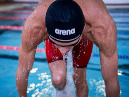 [Swimmer stepping out of a pool]