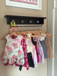 A beautiful idea for a clothing rack when you don't have a closet available. Playful Space Saving Baby Clothing Rack Wall Hung Ikea Hackers Baby Clothes Organization Clothing Rack Diy Baby Clothes