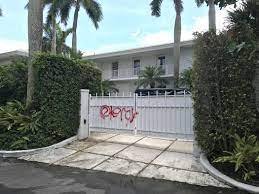 The millionaire financier's home in new york city was raided. Updated Graffiti Left On Gates Of Epstein S House In Palm Beach News The Palm Beach Post West Palm Beach Fl