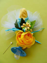 The baby sock corsage made from baby socks, which makes it a nice gift to give back to the expectant mother. Baby Shower Corsage Yellow Baby Socks Yellow Ribbons Handmade Other Gift Party Supplies Home Garden