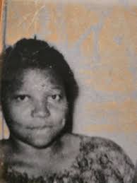 This is the only picture of my grandma my mom and her siblings have. Its  cropped from a bigger picture. Just wondering if it can be cleaned up. TIA! 