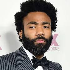 After working on derrick comedy while studying at new york university , glover was hired at age 23 by tina fey as a writer for the nbc sitcom 30 rock. Childish Gambino Donald Glover Bio Affair In Relation Net Worth Ethnicity Salary Age Nationality Height Actor Singer Producer Writer