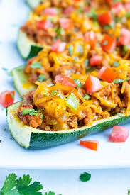 Place the uncovered baking sheet in the preheated oven and bake it for 20 minutes. Mexican Taco Stuffed Zucchini Boats Evolving Table