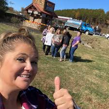 Michelle Johnson, Mindy Coble and Carrie Voss were able to stop by the  Fireside Chalets and Cabin Rentals office in Pigeon Forge last week before  they toured cabins that Keys to Dream