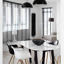 But they were low and i felt like i wanted chairs with more of a presence in the room. Elegant Dining Room With Stylish Black And White Table Black And White Chairs White Walls And Window With Black Blinds Stock Photo Picture And Royalty Free Image Image 156866594