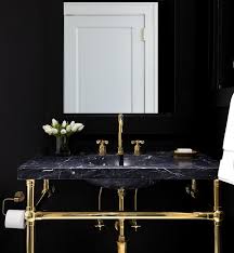 black marble and brass sink vanity on