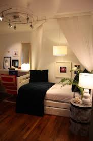 The are rug under the bed is consistent with the color of the wood. Simple Small Bedroom Decorpad