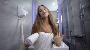 Malke your bathroom awesome with some cool bathroom accessories and & unique bathroom gifts, we feature heaps of cool things for your bathroom! Girl In Bathroom Young Woman In A Towel With Long Beautiful Hair Has Fun In The Shower Dancing With A Hairdryer In Her Hands Video By C Ostapchuk Aa Gmail Com Stock Footage 306580818