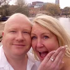 Hi folks. Our engagement picture but the wife's hair along my bald head  makes me look like Rab C Nesbitt. Possible to remove the hair off my head  please 🙏