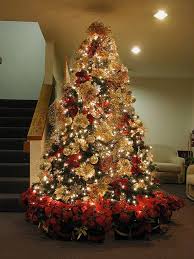 I even tucked dozens deep into the branches and hung others on the tips of the branches. 7 5 Ft Red Gold Christmas Tree Elegant Christmas Trees Elegant Christmas Tree Decorations Gold Christmas Tree Decorations