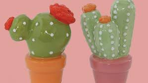 Pure white ceramic in the shape of people. Cool Cactus Salt And Pepper Shakers