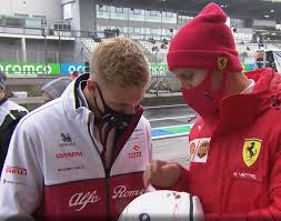 Here is a gallery of the helmet. Sebastian Vettel Showing Mick Schumacher The Tribute On His Helmet To Michael Schumacher Formula1