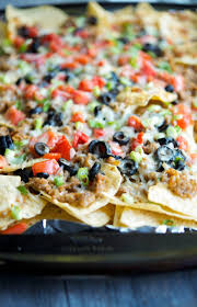 Italian Nachos Made With Ground Pork Sausage Black Olives Tomatoes Scallions And Melted Asiago Ch Healthy Superbowl Snacks Italian Nachos Sausage Appetizers