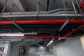 Exposed Ceiling With Painted Pipes
