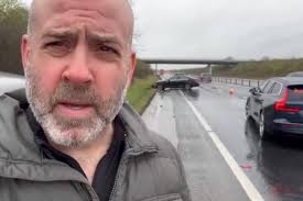 Off-duty Bedford police officer blasts commuters as he and others help  aquaplaning driver