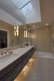 Floating Cabinets With Lights Under And Skylight Above So Gorgeous Sun Tunnels And Skylights Bathroom Vanity Designs Contemporary Bathroom Designs Bathr