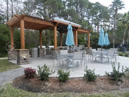 Whether you are going to the yard or an outdoor concert, these large sun umbrellas are perfect! Patio Furniture With Umbrellas On Stone Patio Near Upscale Condo Stock Photo Picture And Royalty Free Image Image 37373198