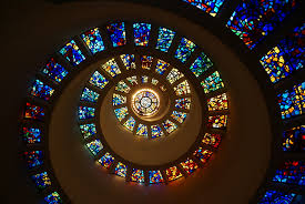 Thanksgiving square is dominated by a statue of a woman holding a hoop. Thanks Giving Square Church In Dallas Thousand Wonders