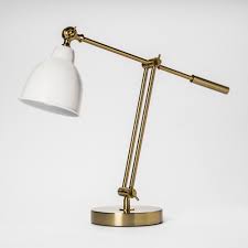 Many people decorate their side table with endearing photo frames and little mementos. 22 X 7 Metal Task Table Lamp Gold White Threshold Gold Table Lamp Lamp Metal Table Lamps