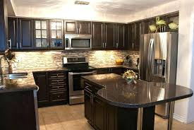 Tiles are the most popular choice when it comes to kitchen backsplashes because of their durability, affordability and variety. Backsplash With Dark Cabinets Nbizococho
