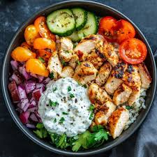 Delicious Greek Chicken Souvlaki Bowls. I love to serve these with roasted  fries and tzatziki. So good! Get the recipe here:  https://www.dimitrasdishes.com/loaded-greek-chicken-souvlaki-bowls/