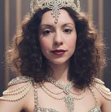 Taylor Swift recently unveiled a series of extravagant outfits for her new  album, "The Life of a Showgirl," featuring plenty of crystals and scalloped  diamonds. Swift's Showgirl style is capturing the attention