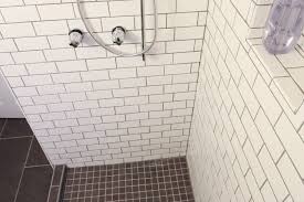 Made of fiberglass or acrylic, they have an expanded polystyrene (eps) base place tile spacers flat side down along the shower base where it meets the shower base flange. How To Tile Your Bathroom Shower Like A Pro Apartment Therapy