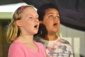 Musical theater 'experiment' links volunteers with kids eager to learn