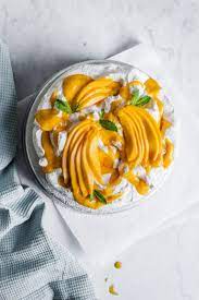 Coconut Meringue Cake With Mango Puree And Sliced Mango The Floured Table Recipe Meringue Cake Mango Puree Meringue