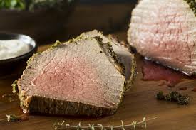 Top slices of beef tenderloin with a rich sauce of cremini mushrooms and sweet red wine. Roasted Garlic And Herb Crusted Beef Tenderloin